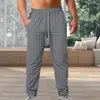 Pantalon masculin pantalon à imprimé vertical rayé avec un pantalon décontracté avec des poches à roues à roues élastiques style streetwear pour un