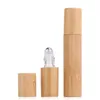 Bouteilles de rangement 100pcs / lot 3 ml 5ml10 ml de bambou naturel rechargeable à l'huile essentielle vide Perfume en acier à rouleau en acier Verre