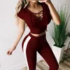 Pantalon de deux pièces pour femmes vendant un long ensemble de deux pièces à manches courtes sexy avec un slim ajustement et un sweat à swaveur nombril exposé Sports de yoga