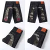 Hu yin fu shen wu fen pantalones de verano de verano de hombres cortos estampados bordados big m jacquard jeans delgados sueltos 341190