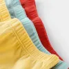 Ropa interior 12pcs/lote de color puro chicas bragas de algodón pantalones cortos de algodón calzado para niños ropa pantalones pantalones