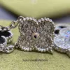 High -end sieradenarmbanden voor Vancleff dames zwart en wit gekleurde vijf bloemarmband dubbelzijdig jade chalcedony licht luxe hand niet origineel 1: 1 met logo
