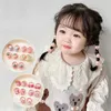 Accessoires de cheveux 2/10 pcs / sac bébé filles mignon cartoon fleur arc brunchies bandoulins enfants