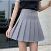 Mini jupes Femmes S-3xl Japan Style Couleur solide Écoliers collégiaux Plemages charmant JK Uniform Preppy All-Match Faldas Londi 240418