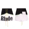 Trendy Rhude Letter Couleur Blocage des sports décontractés Shorts élastiques pour hommes et femmes American High Street Beach Pantal