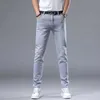 Spring New Light Grey Mens Minimalist Slim Fit Small Feet Fashion Mode European Mand élastique Jean polyvalent