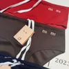 Miu broderade shorts kvinnor triangel bikini trosor designer sömlösa trosor mode strandkläder sexiga spetsar kvinnor sommar simning shorts stammar