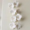 ヘアクリップエレガントな白いセラミック花嫁のためのウェディングジュエリーのためのシンプルな花柄のヘッドピース女性デイリーパーティーヘアリップ