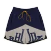 Trendiga varumärke Rhude Micro -etikett Tryckt färgblockering av dragkant Casual Shorts för män och kvinnor High Street Beach Sports Capris