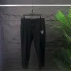 Pantalones para hombres Diseñador de otoño e invierno Pantalones Madre de alta calidad Pantalones de alta calidad Comercio de lujo Color sólido Casual#A10