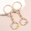 Keychains 1set (2 stcs) Leuke email Keychain Flower Butterfly Crystal Key Ring Garne kettingen voor vriendschapsgeschenken DIY Handgemaakte sieraden