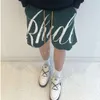 Brand di moda Rhude Lettera Jacquard Shorts casual maglione a maglia per uomini e donne, American High Street Capris