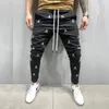 Pantaloni da uomo da uomo jogging bianco tattico tattico harajuku da cranio ricamo magro