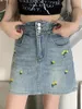 Jupes hautes hautes jupe denim en ligne femme vintage broderie floral mini jeans été 2024