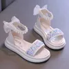 Zapatilla 2024 lentejuelas de las niñas sandalias romanas nuevos niños princesas sandalias bowtie moda chic niños causales de gelatina abierta sandalsl2404