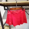 Femmes sportives de tennis sportif court anti-glip faux deux pièces avec doublure haute taille plissée rythme rival de yoga fiess short lul-21