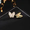 Hoge versie modieuze high-end veelzijdige temperament van vlinder oorbellen dames asymmetrische blauwe glazuur volle diamanten sieraden