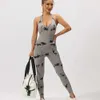 Women's Jumpsuits Rompers Sexy backless jumpsuit suitable for womens fitness push up hollow slimming fitness gym jumpsuit sports tight fitting suit Y240425