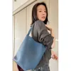 Jie The Lazy Row Pending Bag Tote Dong stor kapacitet One Shoulder Handheld Cowhide Bucket Tote Womens Bag 4 1ppy