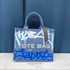 Designer Women's Mac Tote Bag Womens 2024 Ny utländsk stil Graffiti Bag Summer Trend Creative Messenger Shoulder