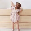 Rompers Summer Baby Girls Rompers Ruffles Raiper Cotton Linen Tissu Sobrave sans manches