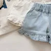 Shorts barns nya sommarbarn och flickor ruffle shorts solida kort denim barn och flickor jeans H240425