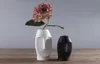 ミニマリストセラミック抽象花瓶黒と白の人間の顔クリエイティブディスプレイルーム装飾的なフィギューヘッドシェイプVase9242645