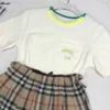 Markenprinzessin Kleid Kids Tracksuits Babykleidung Größe 100-150 cm bestickter Logo-T-Shirt und kariertes Design kurzer Rock 24APRIL