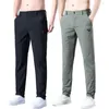 Calças masculinas Primavera Summer Homens casuais finos trechos magros e elásticos da cintura elástica clássica calça coreana masculina verde cinza