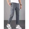 Nova calça masculina casual, calça de jeans frouxos da marca Spring/Summer, versão coreana da cintura elástica masculina versátil e calça cortada