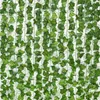 装飾的な花12pc緑の絹の人工吊りガーランド植物葉の葉diyホームウェディングパーティーバスルームガーデンデコレーション偽物
