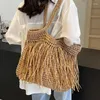 Drawstring Bohemian Tassel Hollow Tote Bag Designer Straw Woven Women Handväskor Sommarstrandsäckar Casual Bali axel