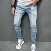 Jeans magri strati strappati da uomo elastico elastico foro piccolo moto pantaloni in denim streetwear maschio 240417