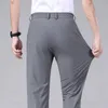 Pantalon masculin printemps d'été pantalon décontracté business slim fit slim élastique jogger jogger coréen classique mince pantalon gris noir mâle d240425