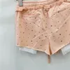 Shorts femininos shorts casuais atrelamento para mulheres 2024 Verão solta cintura alta cintura que corresponde a uma calça de moletom curta irregular que combina