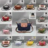 Butikhandväskor är på frigångsförsäljning 95% rabatt 2024 Spring Bag Street mode Kvinnors fotografering Handväska Dumpling Small Välj axel Små väskor