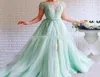 Mint Green Prom Dress Crew Cap Kort ärm Sidoslits Tängade med pärlor Aline Tulle Sashes Backless Long Formal Evening Gown Fo3186941