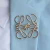 2024 BROOCHES DE DÉCRIE CLASSIQUE SPRING ÉTÉ PINS POUR FEMMES MEN MEN Luxury L Lettres Géométrie Gol