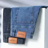 Vårens sommarmärke mens passar rak lätt bomullssträng denim affär casual hög midja tunna ljusgrå jeans 240418