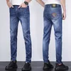 Men's Jeans Designer Spring and summer thin color head VJ half face cotton elastic blue slim legged mens jeans 82D6