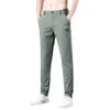 Calças masculinas Primavera Summer Homens casuais finos trechos magros e elásticos da cintura elástica clássica calça coreana masculina verde cinza