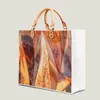Akşam çantaları 2024 ünlü lüks tasarımcı büyük kapasiteli çanta geometrik yaprağı alışveriş çantası pvc parlak kare kraft kağıt kadınlar