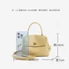 Weiche Textur Cowhide Gold Button Handtasche Stadt Laden Mini Größe Mode vielseitig ein Schulter -Cross -Body -Bag Damen