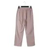 Pantalon pour femmes coton et lin à rayures à rayures élastiques boutons de poche hauts neuf points lâches occasionnels