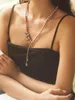 ネックレスイヤリングセットファッショントレンドレトロヘビー業界の文学的エレガンスパール光沢のあるクリスタル葉オートクチュールドレスネックレス