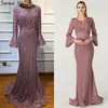 Feestjurken moslimroze luxe luxe lange mouwen avondparels kristallen kant formele jurken 2024 Dubai serene hill plus size bla60813