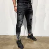 Un jean à ajustement serré étiré mâle détruit pantalon de denim à hommes slim de haute qualité.