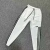 Pantaloni da uomo per maschi Summer Nuovo stile Culleging Slim versatile Splicing con i pantaloni da uomo a tre strisce maschili si adattano ai pantaloni per gambe arti