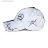 Ball Caps New black and white graffiti baseball cap with colorful blocking personality men and womens iron ring tidal hip-hop foot cap Q240425