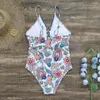 Kvinnors badkläder 2024 baddräkt snör upp etnisk stil sommar kvinnlig bikinis andningsbar monokini djup v hals sexig och strandkläder